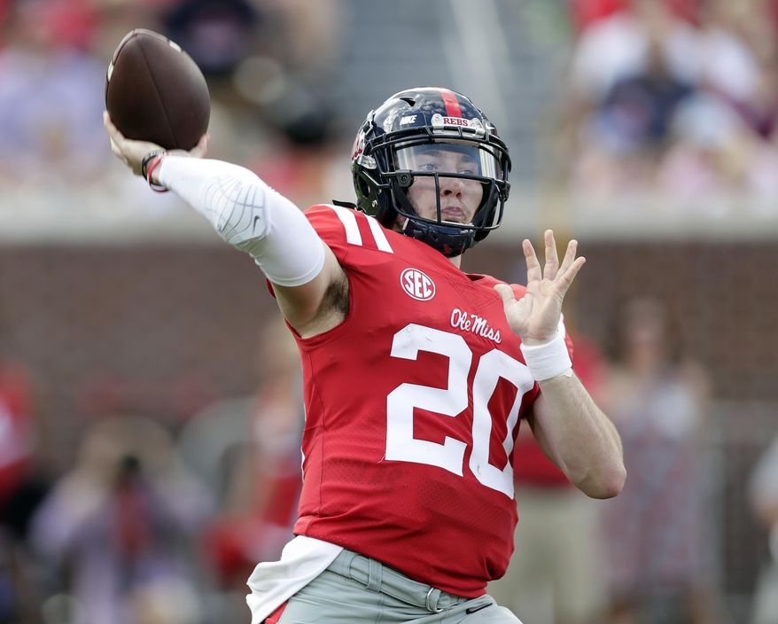 FILE - In this Oct. 14, 2017, file photo, Mississippi quarterback Shea Patterson (20) passes against Vanderbilt in the first half of an NCAA college football game in Oxford, Miss. Patterson says he will transfer to Michigan, where coach Jim Harbaugh has gone through three starting QBs this season. Patterson made his commitment in a tweet on Monday, Dec. 11, 2017, after visiting the Ann Arbor, Michigan, campus last weekend. (AP Photo/Rogelio V. Solis, File)