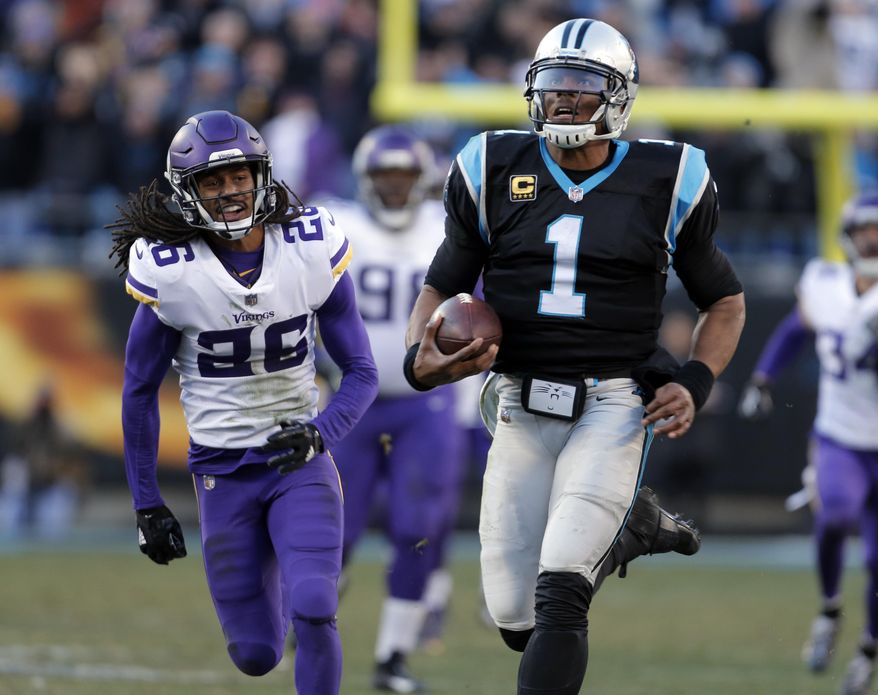 Carolina Panthers' Cam Newton (1) runs for a long gain as Minnesota Vikings' Trae Waynes (26) pursues during the second half of an NFL football game in Charlotte, N.C., Sunday, Dec. 10, 2017. (AP Photo/Bob Leverone)