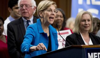 Sen. Elizabeth Warren, D-Mass., center, accompanied by Sen. Bernie Sanders, I-Vt., left, and Sen. Kirsten Gillibrand, D-N.Y., right, speaks during a news conference on Capitol Hill in Washington, Wednesday, Sept. 13, 2017, to unveil their Medicare for All legislation to reform health care. (AP Photo/Andrew Harnik) **FILE**