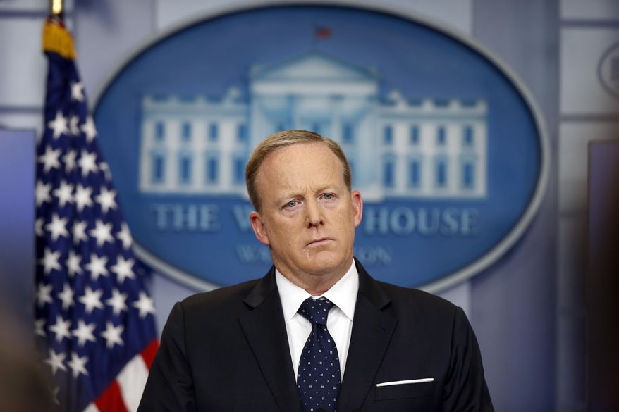 In this June 20, 2017, file photo, White House press secretary Sean Spicer listens to a reporter's question during a briefing at the White House in Washington. (AP Photo/Alex Brandon, File)