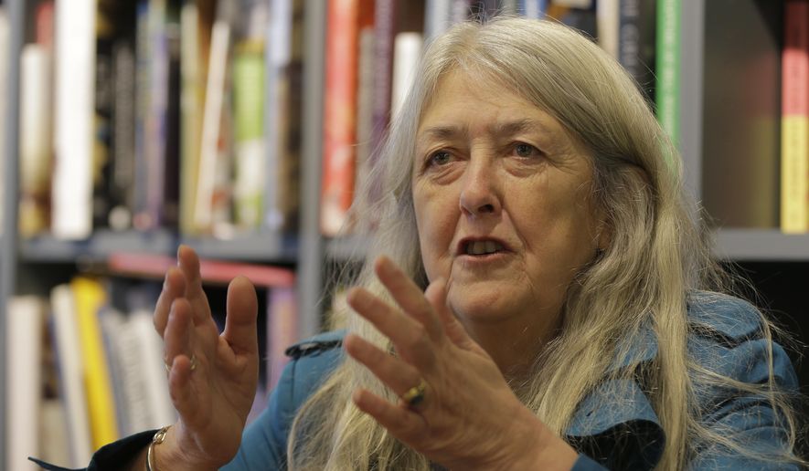In this photo taken Wednesday, Nov. 29, 2017, British author Mary Beard gestures during an interview with the Associated Press talks about her new book 'Women in Power' in London. A new book by classical historian Mary Beard links Greek mythology to modern Twitter trolls, arguing both have a problem with women who speak up. (AP Photo/Alastair Grant)
