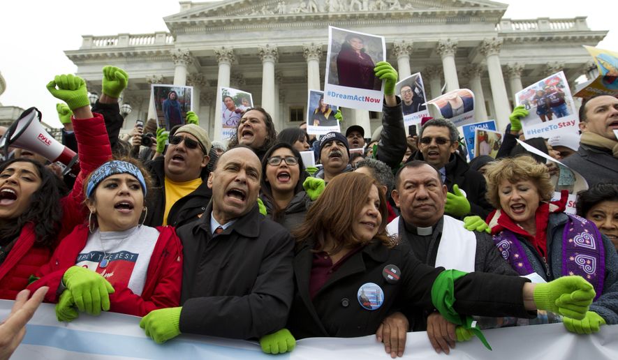 In this Dec. 6, 2017 photo, Rep. Luis Gutierrez D-Ill., third from left, along with other demonstrators protest outside of the U.S. Capitol in support of the Deferred Action for Childhood Arrivals (DACA), and Temporary Protected Status (TPS), programs, during an rally on Capitol Hill in Washington.  House and Senate Democrats stand divided over whether to fight now or later about the fate of some 800,000 young immigrants who came to the U.S. illegally as children. ( AP Photo/Jose Luis Magana) **FILE**