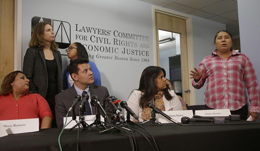 Gladys Fuentes, right, one of five female kitchen workers in Boston speaks about her experiences while detailing a sexual harassment lawsuit the women are filing against McCormick & Schmick's, a national restaurant chain featuring seafood and steaks Tuesday, Dec. 12, 2017, in Boston. The Lawyers' Committee for Civil Rights and Economic Justice, a Boston-based nonprofit representing the women, says the lawsuit alleges a workplace filled with "lewd behavior, sexually inappropriate comments and unwanted touching." Also pictured are plaintiff Marta Romeno (left to right), attorney and interpreter Ivan Espinoza-Madrigal, plaintiff Fabiana Santos, attorney's Rachel Smith (back row left to right) and Sophia Hall. (AP Photo/Stephan Savoia)