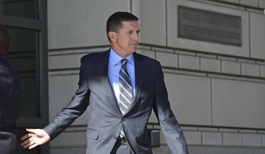 In this Dec. 1, 2017, file photo, former Trump National Security Adviser Michael Flynn leaves federal court in Washington. (AP Photo/Susan Walsh) ** FILE **