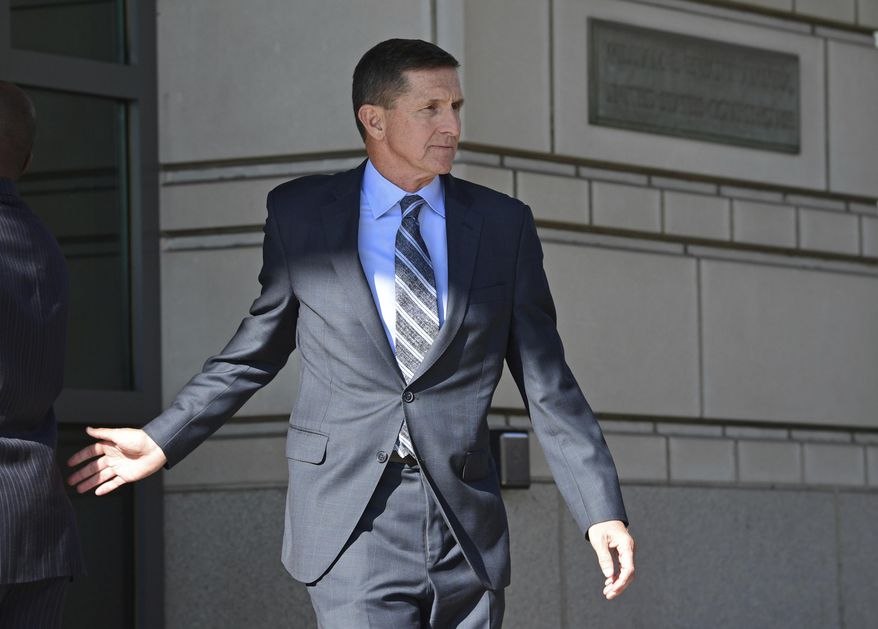In this Dec. 1, 2017, file photo, former Trump National Security Adviser Michael Flynn leaves federal court in Washington. (AP Photo/Susan Walsh) ** FILE **