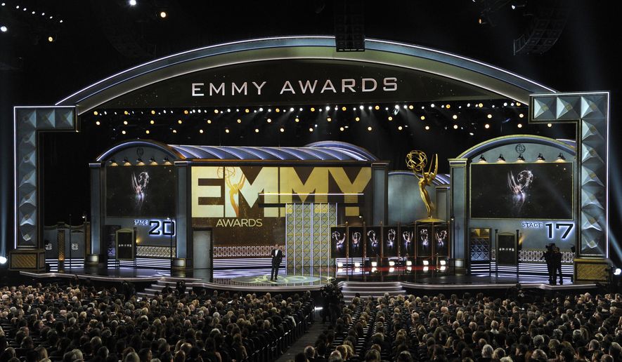FILE - In this Sept. 17, 2017 file photo, host Stephen Colbert speaks at the 69th Primetime Emmy Awards in Los Angeles. The next Primetime Emmy Awards will move to Monday night to avoid a huge potential tackle by “Sunday Night Football.” NBC and the Television Academy said Tuesday, Dec. 12, that the three-hour telecast will air next year on Sept. 17. (Photo by Chris Pizzello/Invision/AP)