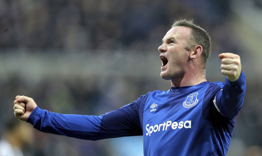 Everton's Wayne Rooney celebrates scoring his side's first goal of the game against Newcastle during their English Premier League soccer match at St James' Park in Newcastle, England, Wednesday Dec. 13, 2017. (Owen Humphreys/PA via AP)