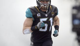 FILE - In this Dec. 4, 2016, file photo, Jacksonville Jaguars middle linebacker Paul Posluszny (51) takes the field during introductions before an NFL football game against the Denver Broncos, in Jacksonville, Fla. Posluszny has 1,200 tackles, 16 sacks and 15 interceptions in 11 years in the NFL _ and finally has his first winning season. Jacksonville&#39;s ninth victory secured the milestone for Posluszny, whose career achievement was recognized by teammates and coaches in the locker room. (AP Photo/Phelan M. Ebenhack, File)