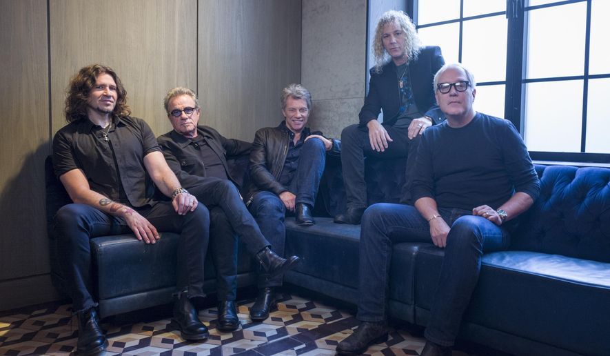 FILE - In this Oct. 19, 2016 file photo, members of Bon Jovi from left, Phil X, Tico Torres, Jon Bon Jovi, David Bryan and Hugh McDonald pose for a portrait in New York. The band will be inducted into the Rock and Roll Hall of Fame on April 14, 2018 in Cleveland, Ohio. (Photo by Drew Gurian/Invision/AP, File)