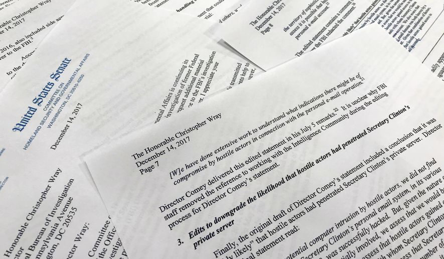 Parts of a letter written by Sen. Ron Johnson, R-Wis., to FBI Director Christopher Wray are photographed in Washington, Thursday, Dec. 14, 2017. Johnson says edits to a draft FBI statement on the Hillary Clinton email investigation appear to have watered down the significance of the bureau's findings. (AP Photo/Jon Elswick)