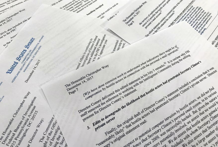 Parts of a letter written by Sen. Ron Johnson, R-Wis., to FBI Director Christopher Wray are photographed in Washington, Thursday, Dec. 14, 2017. Johnson says edits to a draft FBI statement on the Hillary Clinton email investigation appear to have watered down the significance of the bureau's findings. (AP Photo/Jon Elswick)