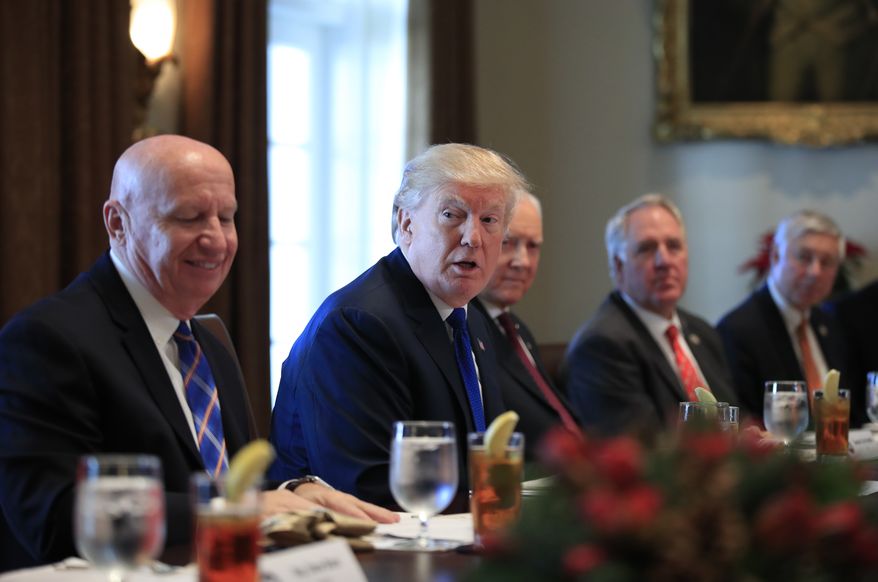 President Donald Trump speaks during a bicameral meeting with lawmakers working on the tax cuts in the Cabinet Meeting Room of the White House in Washington, Wednesday, Dec. 13, 2017. Attending the meeting are, from left, Rep. Kevin Brady, R-Texas; Trump; Sen. Orrin Hatch, R-Utah; Rep. John Shimkus, R-Ill., and Rep. Fred Upton, R-Mich. (AP Photo/Manuel Balce Ceneta)