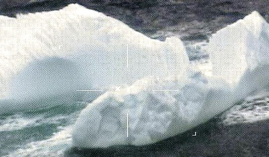FILE - This March 2017 photo released by the U.S. Coast Guard and made by a robotic camera aboard a reconnaissance aircraft, shows icebergs floating near the Grand Banks of Newfoundland in the North Atlantic Ocean. The U.S. Coast Guard says about 1,000 icebergs drifted into the North Atlantic shipping lanes this year, marking the fourth consecutive "extreme" ice season. The Connecticut-based Coast Guard International Ice Patrol monitors iceberg danger in the North Atlantic and warns ships. It held its annual meeting Thursday, Dec. 14 in New London, Conn., to discuss 2017 and look ahead to 2018. (U.S. Coast Guard via AP, File)