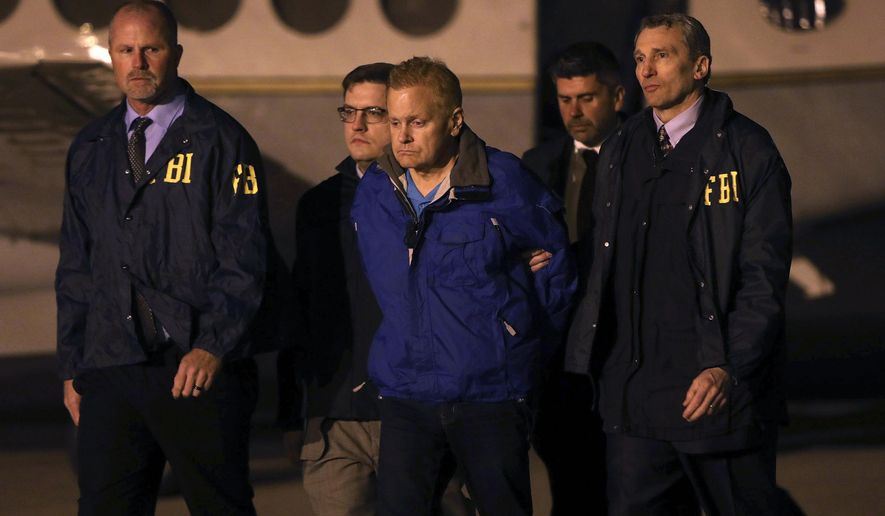 FILE - In a Tuesday, Dec. 5, 2017 file photo, fugitive lawyer Eric Conn is taken into custody by FBI agents on the tarmac at Blue Grass Airport in Lexington, Ky. Conn is facing prosecution on charges he would have avoided if he had not vanished for six months to avoid prison. A federal prosecutor filed court papers signaling the government will try Conn on more than a dozen charges including mail fraud, wire fraud and money laundering. If convicted, Conn could spend the rest of his life in prison. (AP Photo/Matt Goins, File)