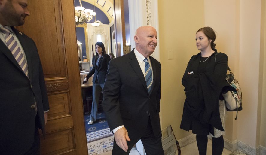 House Ways and Means Committee Chairman Kevin Brady, R-Texas, leaves his office in the Capitol as House Republicans prepare to advance the GOP tax bill, in Washington, Friday, Dec. 15, 2017. (AP Photo/J. Scott Applewhite)