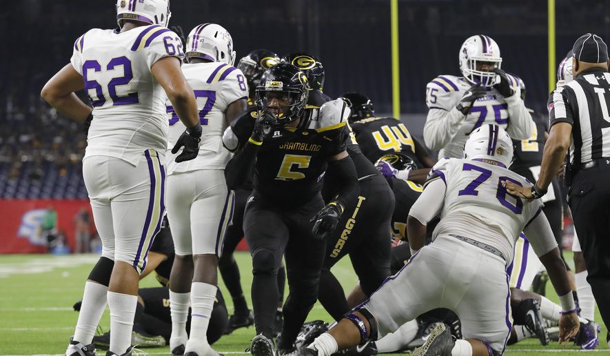 FILE - In this Dec. 2, 2017, file photo, Grambling State linebacker De'Arius Christmas (5) reacts after a fourth-down stop in the third quarter during the Southwestern Athletic Conference championship football game against Alcorn State, in Houston. Grambling plays against North Carolina A&T in the Celebration Bowl on Saturday, Dec. 16. Grambling is trying to win its second straight Celebration Bowl and finish off its season undefeated against FCS competition.(Tim Warner/Houston Chronicle via AP, File)