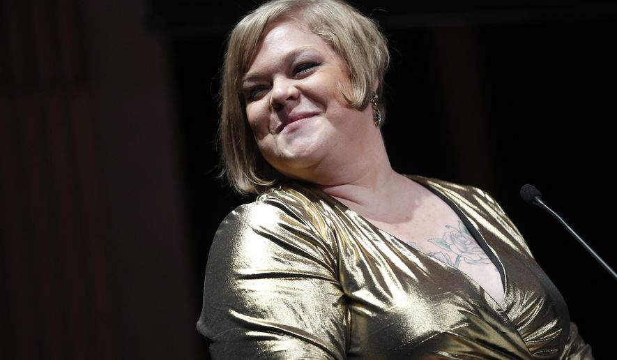 American writer, photographer, and activist, best known for being part of the body positive movement, Jes Baker, delivers a speech during a day against fat phobia in Paris, France, Friday, Dec. 15, 2017. Paris, the seat of global luxury industries and one of the world&#39;s most image-conscious cities, is looking at its contradictions in the mirror with rising obesity levels and is launching a campaign against an often disregarded kind of discrimination: sizeism. (AP Photo/Christophe Ena)