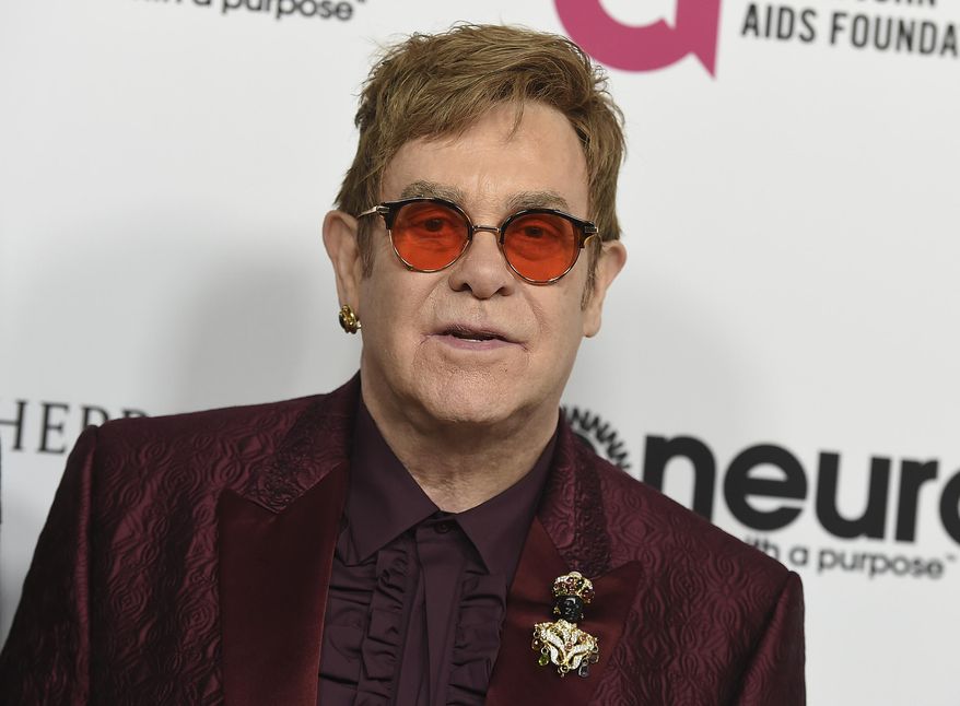 FILE - In this March 25, 2017 file photo, Elton John arrives at Elton John's 70th Birthday and 50-Year Songwriting Partnership with Bernie Taupin celebration in Los Angeles. Sam Smith, Miley Cyrus and Coldplay’s Chris Martin are set to honor Elton John at a tribute concert. The Recording Academy announced Friday that it will tape "Elton John: I'm Still Standing A GRAMMY Salute” at The Theater at Madison Square Garden in New York on Jan. 30, 2018, two days after the 2018 Grammy Awards. (Photo by Jordan Strauss/Invision/AP, File)