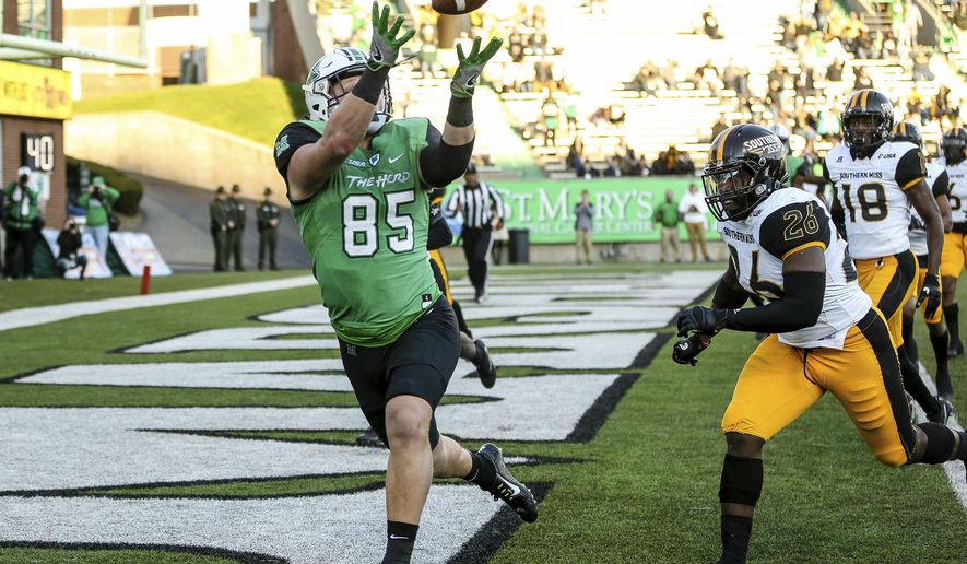 FILE - In this Nov. 25, 2017, file photo, Marshall tight end Ryan Yurachek (85) catches a touchdown pass against Southern Mississippi during an NCAA college football game in Huntington, W.Va. Colorado State and Marshall, two programs that started strong only to end finish slow this season, are meeting in the New Mexico Bowl to help kick off the college postseason. (Sholten Singer/The Herald-Dispatch via AP, File)