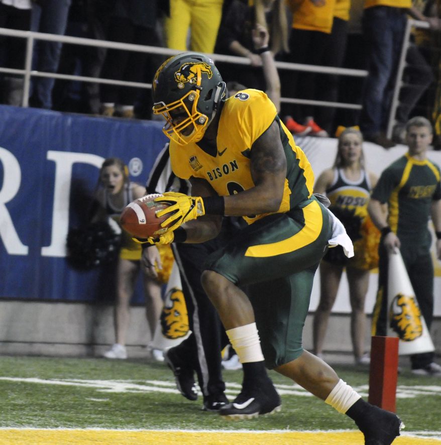 North Dakota State running back Bruce Anderson hauls in a touchdown reception during an NCAA college football game against Sam Houston State, Friday, Dec. 15, 2017 in Fargo, N.D. (Gene Schallenberg/The Huntsville Item via AP)