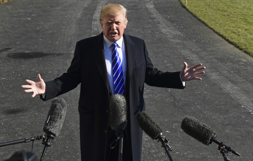 President Donald Trump talks with reporters as he departs from the South Lawn of the White House via Marine One in Washington, Saturday, Dec. 16, 2017, to spend the weekend at Camp David in Maryland. (AP Photo/Susan Walsh)