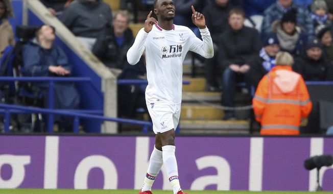 Crystal Palace&#x27;s Christian Benteke celebrates scoring his side&#x27;s first goal of the game during the English Premier League soccer match at the King Power Stadium, Leicester, England, Saturday Dec. 16, 2017. (Nigel French/PA via AP)