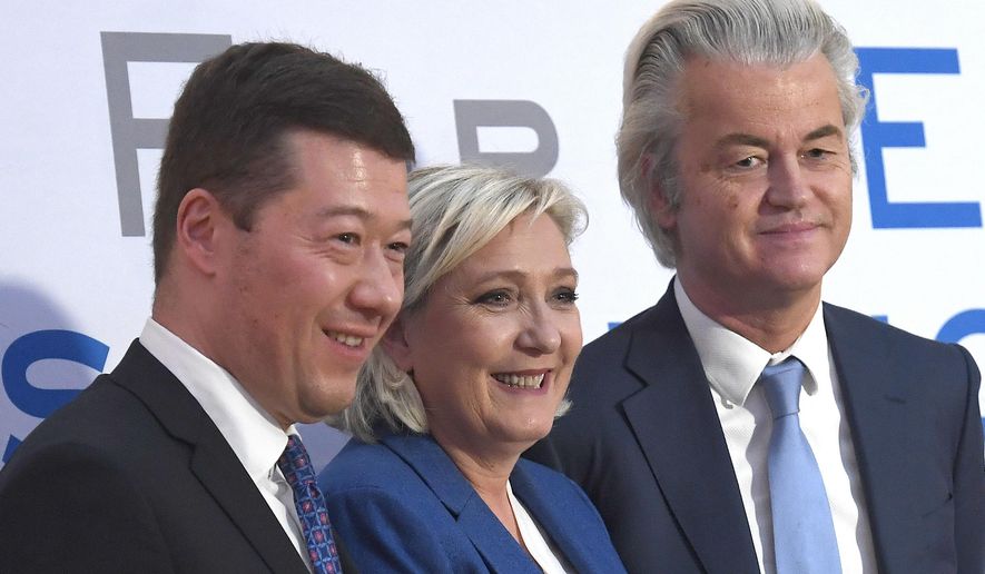 From the left founder and President of Czech Freedom and Direct Democracy party Tomio Okamura, French politician and head of the National Front, Marine Le Pen, and Dutch politician, founder and the current leader of the Party for Freedom Geert Wilders pose for photographers after a press conference at a conference of European anti-migrant parties from the Europe of Nations and Freedom (ENF) Group in the European Parliament, in Prague, Saturday, Dec. 16, 2017. (Michal Krumphanzl/CTK via AP)