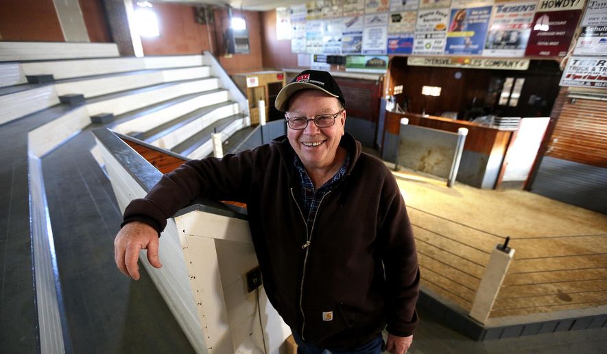 ADVANCE FOR USE SATURDAY, DEC. 16 - In this Friday, Dec. 8, 2017 photo, Randy Hess, manager of the Dyersville Sales Co., Inc., poses in Dyersville, Iowa. Dyersville Sales Co. will hold its final livestock auction Dec. 30. Although weekly hay auctions will continue, the elimination of livestock sales marks the end of a longtime tradition for the family business. (Dave Kettering/Telegraph Herald via AP)