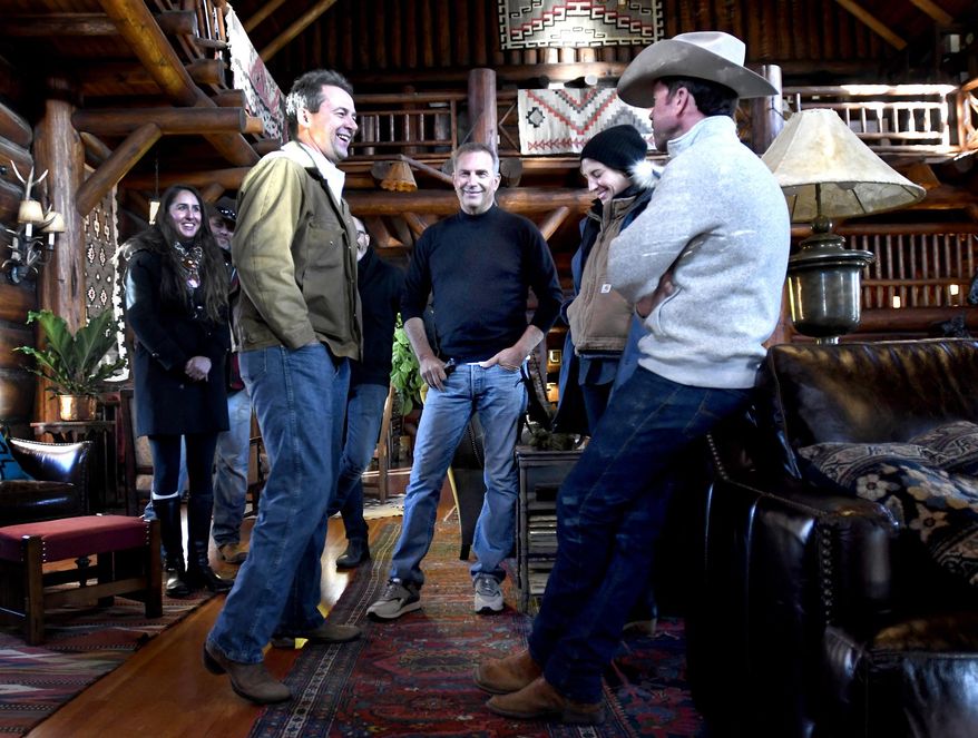 In this Dec. 7, 2017 photo, Montana Gov. Steve Bullock, foreground from left, appears with actor Kevin Costner, production designer Ruth De Jong and writer-director Taylor Sheridan in the lodge at the Chief Joseph Ranch during a visit to the set of the television series  &amp;quot;Yellowstone&amp;quot; in Darby, Mont. The series is set for release in June. (Kurt Wilson/The Missoulian via AP)