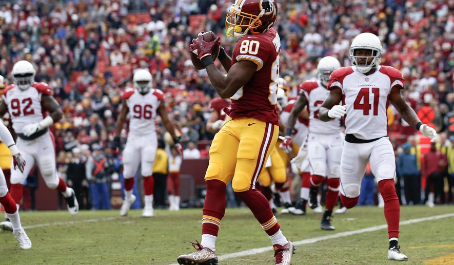 Washington Redskins wide receiver Jamison Crowder (80) pulls in a touchdown pass during the first half of an NFL football game against Arizona Cardinals in Landover, Md., Sunday, Dec 17, 2017. (AP Photo/Alex Brandon)