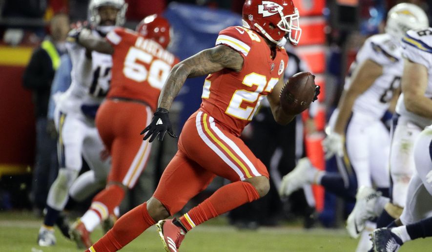 Kansas City Chiefs defensive back Marcus Peters (22) runs for 62-yards after intercepting the ball during the second half of an NFL football game against the Kansas City Chiefs in Kansas City, Mo., Saturday, Dec. 16, 2017. (AP Photo/Charlie Riedel)