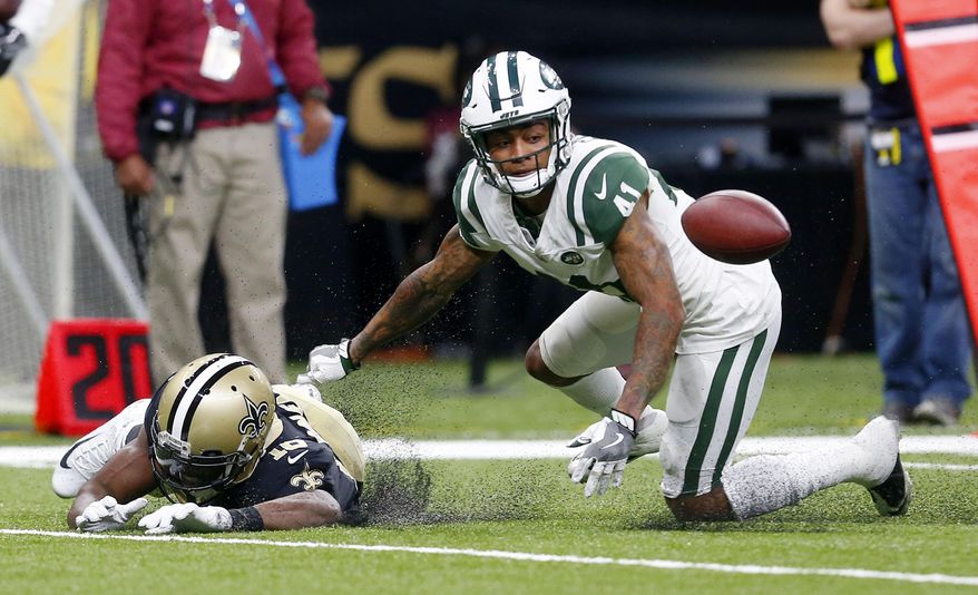New Orleans Saints wide receiver Brandon Coleman (16) fumbles as he is hit by New York Jets cornerback Buster Skrine (41) in the second half of an NFL football game in New Orleans, Sunday, Dec. 17, 2017. (AP Photo/Butch Dill)