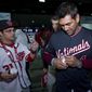 Washington Nationals Manager Dave Martinez sign autographs to children during the Winter Fest celebration with fans at Washington Convention Center in Washington, Saturday, Dec. 16, 2017. ( AP Photo/Jose Luis Magana) **FILE**