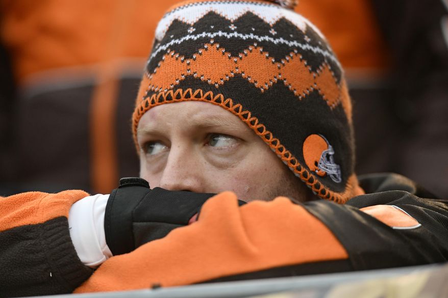 A Cleveland Browns fan watches during the second half of an NFL football game between the Baltimore Ravens and the Cleveland Browns, Sunday, Dec. 17, 2017, in Cleveland. (AP Photo/David Richard)