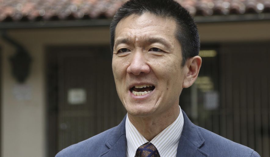 FILE - In this Oct. 17, 2017, file photo, Hawaii Attorney General Douglas Chin speaks to The Associated Press about Hawaii's lawsuit challenging President Donald Trump's travel ban in Honolulu. Chin, who has been fighting Trump's travel ban, has announced he will run for U.S. Congress in a bid to replace Hawaii’s Rep. Colleen Hanabusa. Chin made the announcement Monday, Dec. 18, saying that the last year of legal action against the current administration sparked him to run for office for the first time in his career. (AP Photo/Caleb Jones, File)