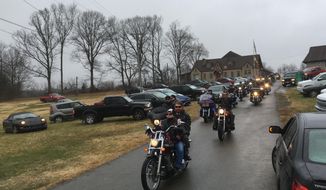 Motorcycle riders leave the funeral for Kentucky State Rep. Dan Johnson in Louisville, Kentucky, on Monday, Dec. 18, 2017. Police say Johnson, a first-term state representative, took his own life days after a media report that he had been accused of sexually assaulting a teenager. The funeral was held at a church where Johnson was known as “the pope.” (AP Photo/Dylan Lovan)