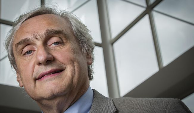 FILE - In this July 24, 2014, file photo, then-Chief Judge of the U.S. Court of Appeals for the Ninth Circuit Alex Kozinski poses for a portrait in the lobby of a Washington office building. The Washington Post says nine more women say they were subject to inappropriate sexual conduct or comments by a prominent U.S. appeals court judge. In a story published on Friday, Dec. 15, 2017, the newspaper says the latest allegations against 9th U.S. Circuit Court of Appeals Judge Kozinski go back decades and include women who met him at events. (AP Photo/J. David Ake, File)