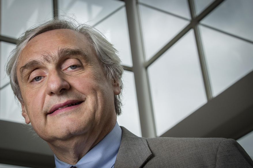 FILE - In this July 24, 2014, file photo, then-Chief Judge of the U.S. Court of Appeals for the Ninth Circuit Alex Kozinski poses for a portrait in the lobby of a Washington office building. The Washington Post says nine more women say they were subject to inappropriate sexual conduct or comments by a prominent U.S. appeals court judge. In a story published on Friday, Dec. 15, 2017, the newspaper says the latest allegations against 9th U.S. Circuit Court of Appeals Judge Kozinski go back decades and include women who met him at events. (AP Photo/J. David Ake, File)