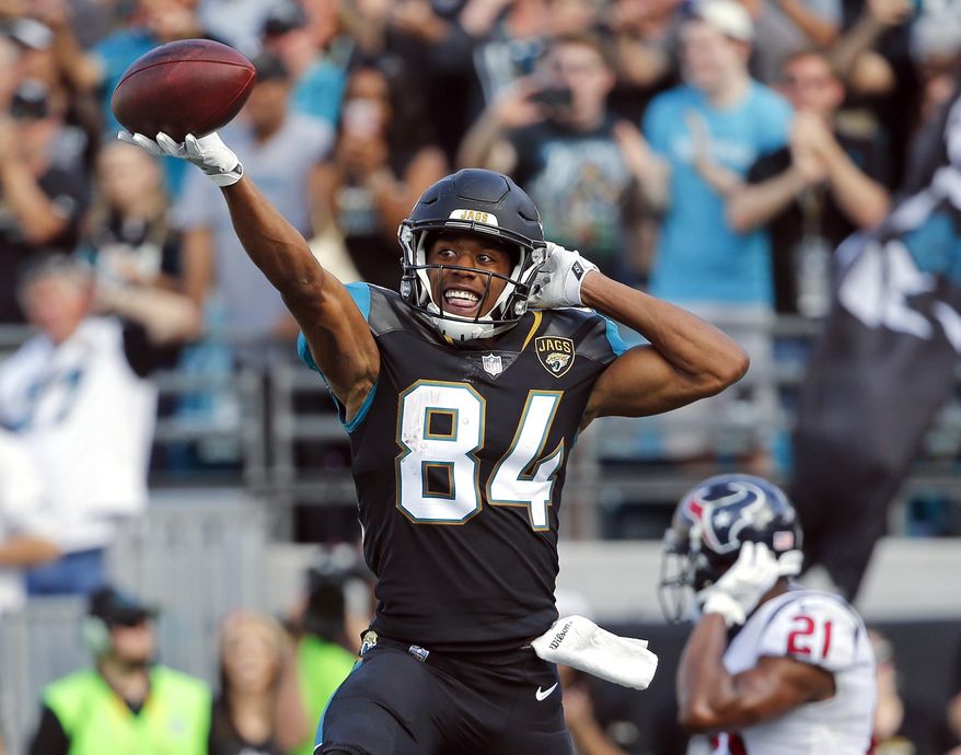 Jacksonville Jaguars wide receiver Keelan Cole (84) celebrates his 9-yard touchdown on a pass play against the Houston Texans during the first half of an NFL football game, Sunday, Dec. 17, 2017, in Jacksonville, Fla. (AP Photo/Stephen B. Morton)