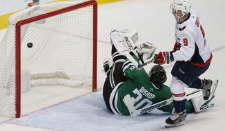 Washington Capitals defenseman Dmitry Orlov (9) scores in front of Dallas Stars goalie Ben Bishop (30) during the second period of an NHL hockey game in Dallas, Tuesday, Dec. 19, 2017. (AP Photo/ Michael Ainsworth)