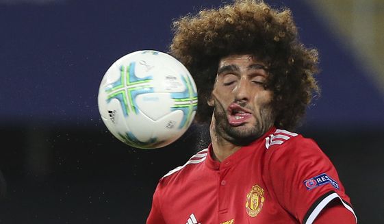 FILE - Manchester United&#39;s Marouane Fellaini heads the ball during the UEFA Super Cup final soccer match between Real Madrid and Manchester United at Philip II Arena in Skopje, on Aug. 8, 2017. (AP Photo/Boris Grdanoski)