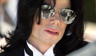 FILE - In this June 13, 2005 photo, Michael Jackson gestures as he leaves court during his trial on child molestation charges in Santa Maria, Calif. Wade Robson, who is now 35, testified at Jackson&#x27;s criminal trial in 2005 that he had spent many nights in Jackson&#x27;s room, but Jackson had never molested him. A judge has dismissed the lawsuit brought by Robson, who alleged Jackson molested him as a child. The summary judgment ruling Tuesday, Dec. 19, 2017, against Robson resolves one of the last remaining major claims against the late singer&#x27;s holdings. (AP Photo/Mark J. Terrill, File)