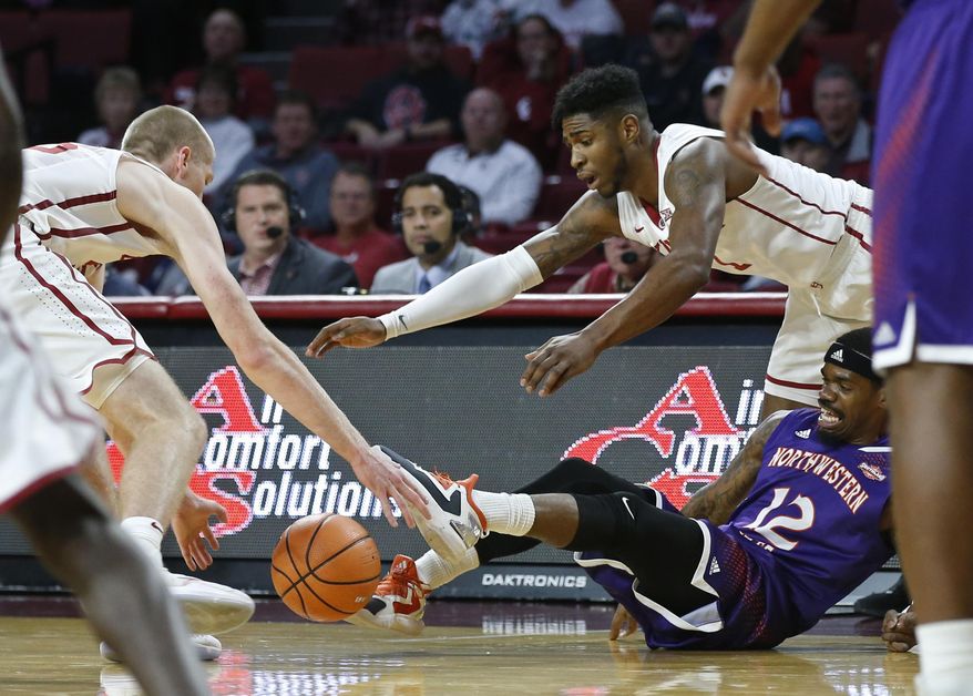 Northwestern State guard Jalan West (12) loses the ball between Oklahoma forward Brady Manek, left, and guard Rashard Odomes (1) in the first half of an NCAA college basketball game in Norman, Okla., Tuesday, Dec. 19, 2017. (AP Photo/Sue Ogrocki)