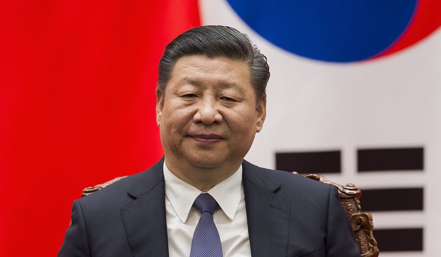 In this Thursday, Dec. 14, 2017, file photo, Chinese President Xi Jinping attends a signing ceremony at the Great Hall of the People in Beijing. Chinese leaders, led by President Xi, promised Wednesday to increase imports and reduce risks in their financial system amid slowing economic growth and pressure from Washington and Europe to open their markets wider. (Nicolas Asfouri/Pool Photo via AP, File)
