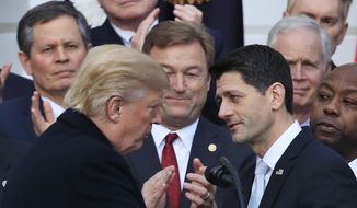 President Donald Trump shakes hands with House Speaker Paul Ryan of Wis., during an event to acknowledge the final passage of tax overhaul legislation by Congress on the South Lawn of White House in Washington, Wednesday, Dec. 20, 2017. (AP Photo/Manuel Balce Ceneta) ** FILE **