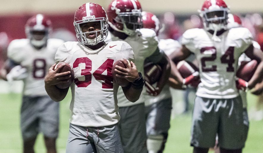 Alabama running back Damien Harris (34) works through drills during football practice, Friday, Dec. 15, 2017, at the Hank Crisp Indoor Facility in Tuscaloosa, Ala. (Vasha Hunt/AL.com via AP)