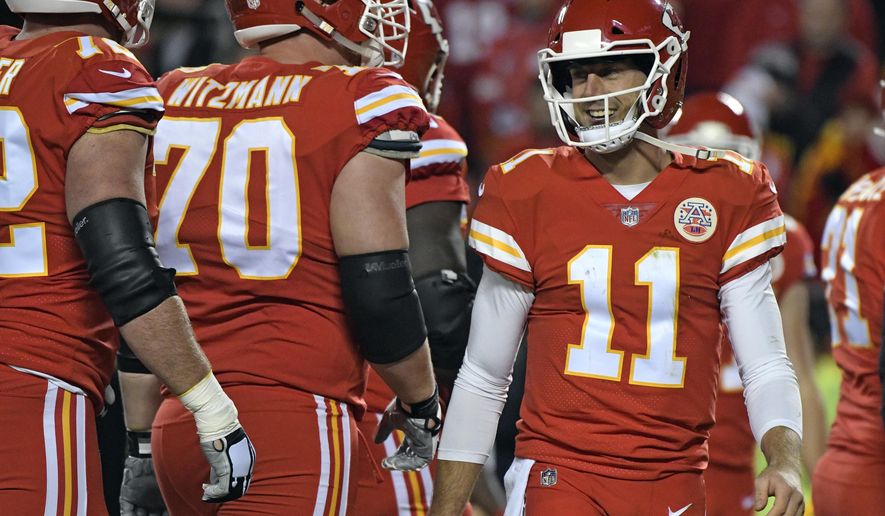 Kansas City Chiefs quarterback Alex Smith (11) smiles during the first half of an NFL football game against the Los Angeles Chargers in Kansas City, Mo., Saturday, Dec. 16, 2017. (AP Photo/Ed Zurga)