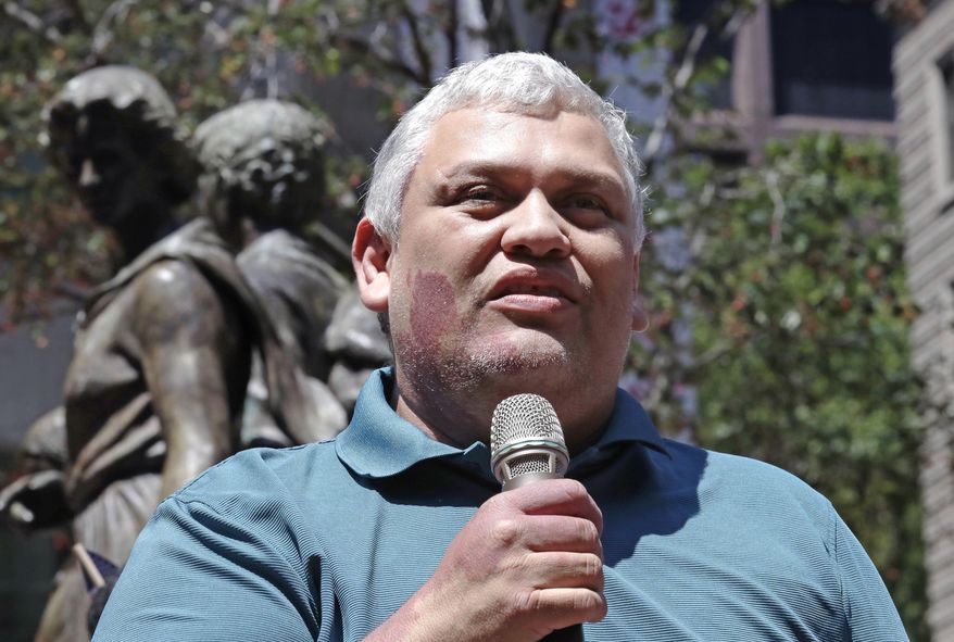 File- In this July 6, 2017 file photo, MIT janitor Francisco Rodriguez speaks during a "Here to Stay" rally at the Irish Famine Memorial in Boston. Rodriguez, who was facing deportation to El Salvador, has been released from a Boston jail. Francisco Rodriguez-Guardado was released by U.S. Immigration and Customs Enforcement on Thursday, Dec. 21, 2017, after being held since July at the Suffolk County House of Corrections. His lawyers say his removal proceedings have been stayed pending their request to reopen his asylum case. Rodriguez-Guardado's mother says the family is "overjoyed." (AP Photo/Charles Krupa)