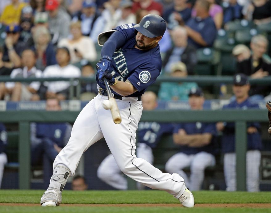FILE - In this Aug. 14, 2017, file photo, Seattle Mariners' Yonder Alonso doubles against the Baltimore Orioles in the first inning of a baseball game in Seattle. A person familiar with the negotiations says free-agent first baseman Yonder Alonso and the Cleveland Indians have agreed to contract terms. Alonso’s deal is contingent on him passing a physical, according to a person who spoke to The Associated Press on condition of anonymity Thursday because the agreement had not been announced. (AP Photo/Elaine Thompson, File)