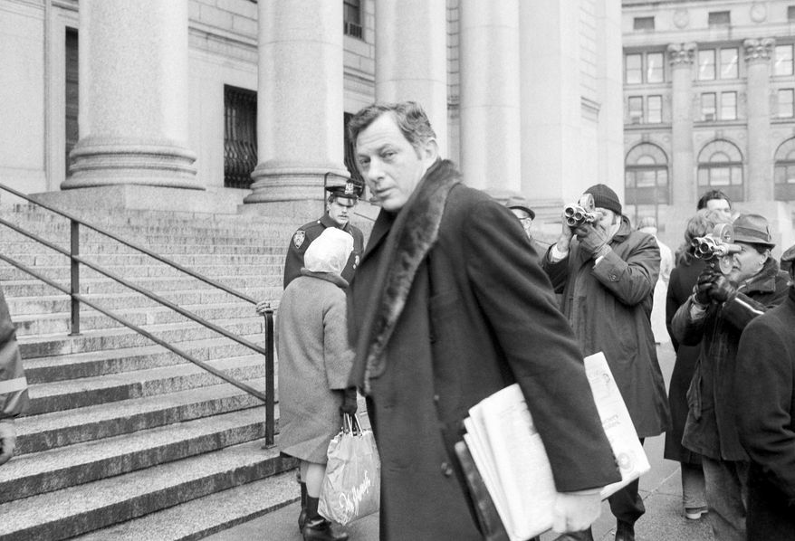 File - In this March 13, 1972 file photo, author Clifford Irving is seen as he enters federal court in New York. Irving, the prankster who wrote a phony autobiography of billionaire Howard Hughes and fooled a major publisher in 1971 has died at 87. The New York Times reports Irving's wife, Julie Irving, confirmed that he died Tuesday, Dec, 19, 2017, at a hospice near his Sarasota home. (AP Photo/Jim Wells, File)